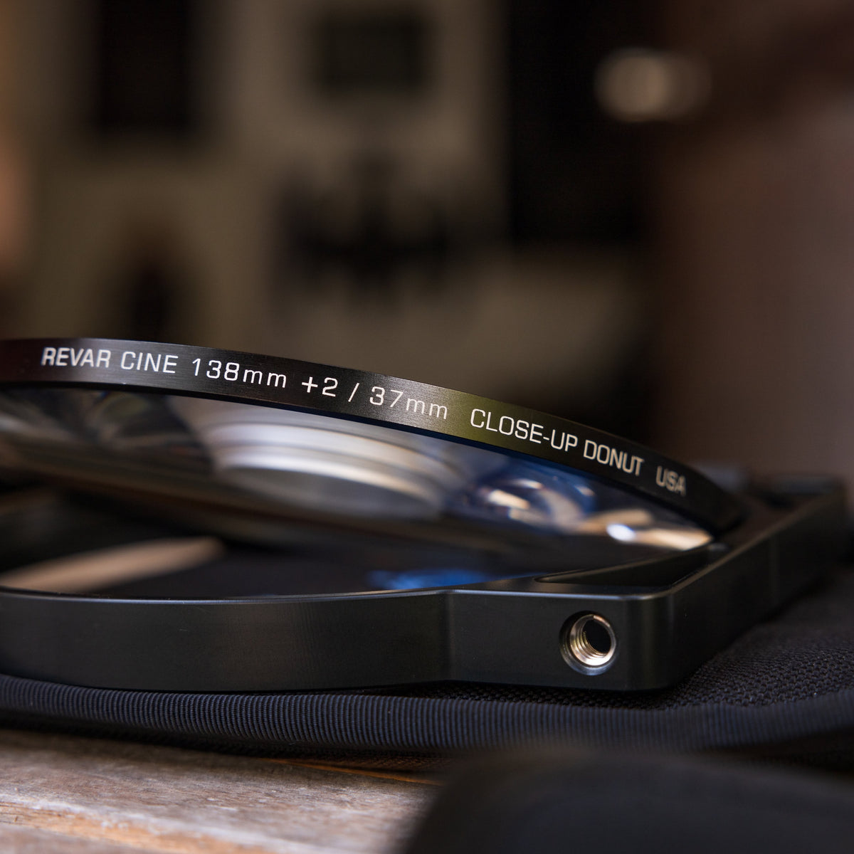 Side view of a Revar Cine Donut Diopter in a filter holder